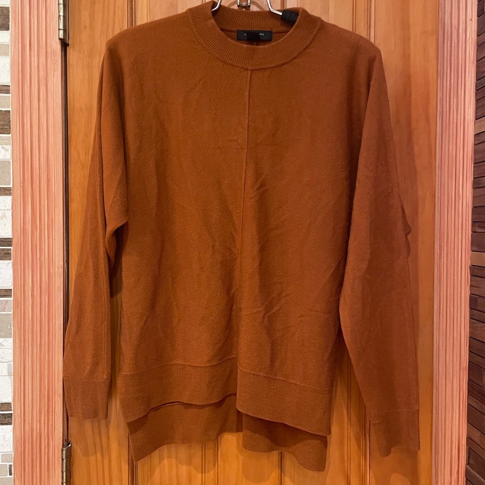 Atmosphere Rust Orange Sweater very soft and comfortable. Like new.